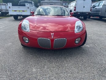 2007 Aggressive (Victory Red) Pontiac Solstice Base 2 Door RWD ECOTEC 2.4L I4 SFI DOHC VVT Engine Manual Convertible